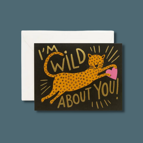 Cheetah holding a heart