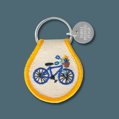 Blue bicycle with yellow border