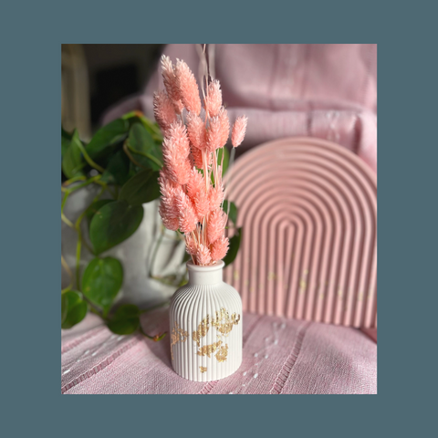 White vase with gold leaf