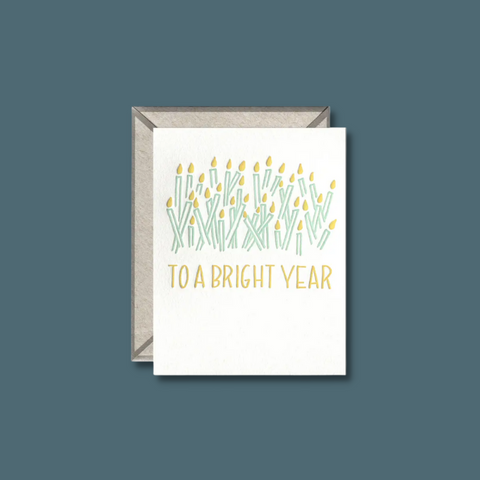 Yellow and green candles and text