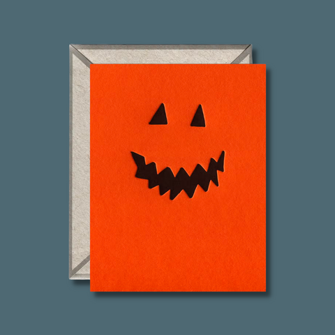 Pumpkin face on orange