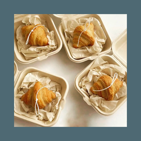 Croissants in take-out boxes