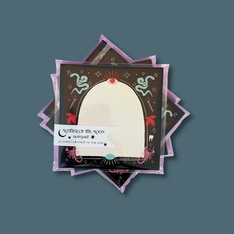 Pad bordered with snakes, eyes, etc