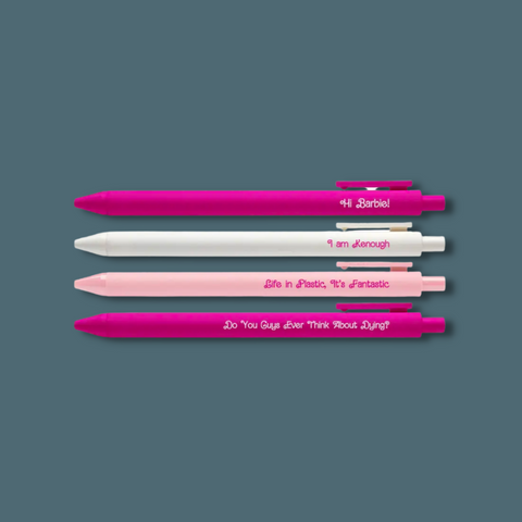 Pink and white pens with Barbie movie quotes on them