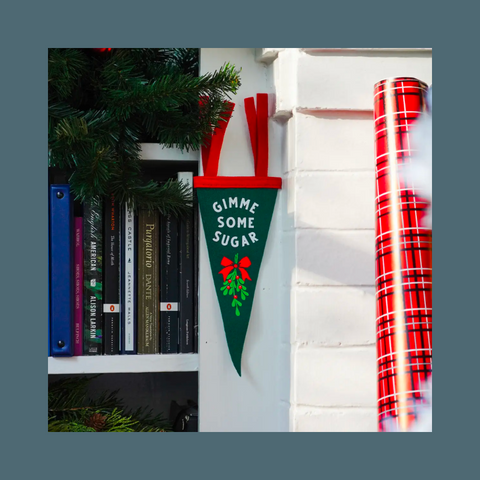 White text and mistletoe on dark green