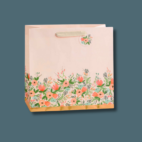 Pastel pink bags with flowers and gold along the bottom