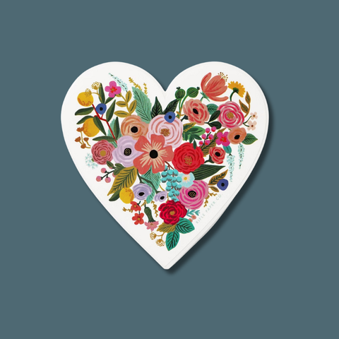 Heart-shaped sticker with colorful floral design on a solid background