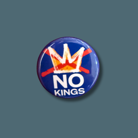 Button badge with 'No Kings' text and crossed crowns on a blue background