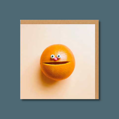 Orange with eyes and nose
