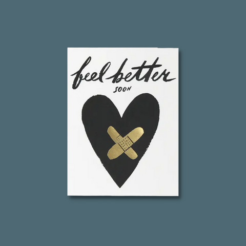 Black heart with gold band-aids