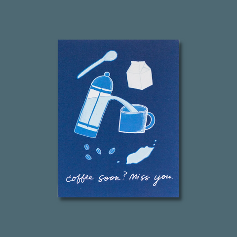 Coffee ingredients and a cup on blue background