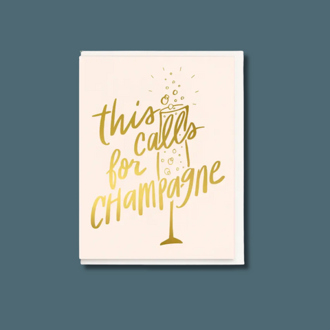 Card with 'This calls for Champagne' gold text on a white background