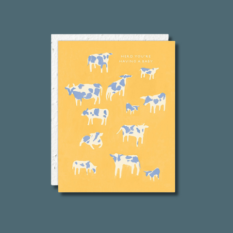 Blue and white cows on yellow background