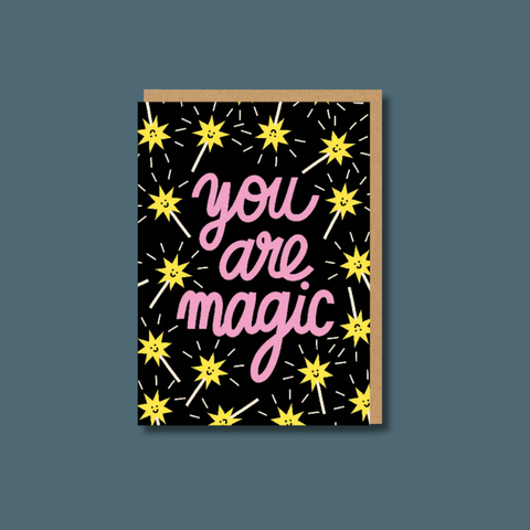 Card with 'you are magic' text and yellow star illustrations on a dark background