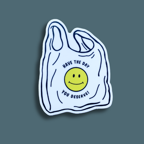 Plastic bag with a half smiley and text on it