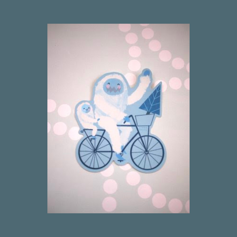 Yeti and yeti child on a bike
