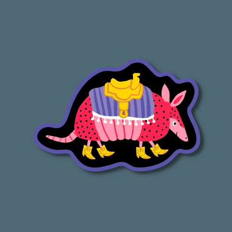 Armadillo wearing boots and a saddle