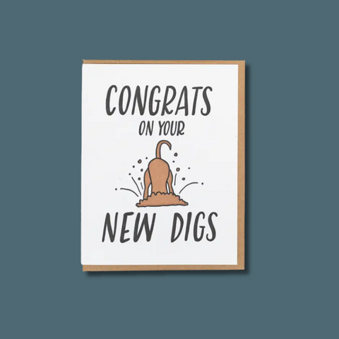 Framed card with text 'Congrats on your new digs' and a dog digging illustration