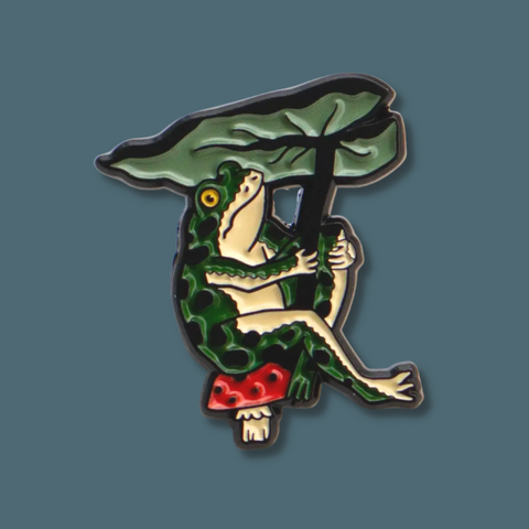 Frog on a mushroom under a leaf