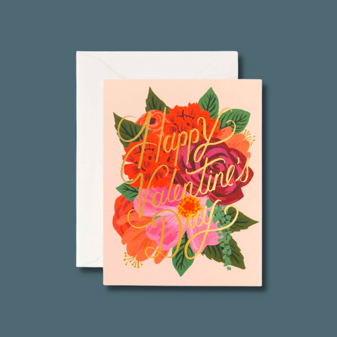 Gold text over red and pink flowers