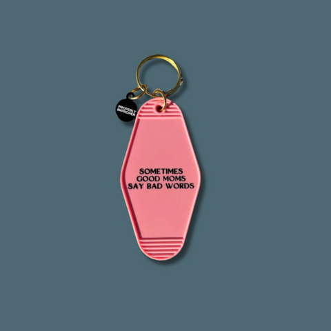 Black text on pink keychain