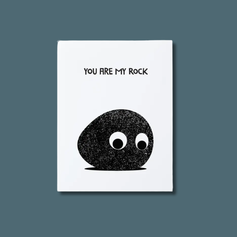 Illustration of a black rock with googly eyes on a white card with 'YOU ARE MY ROCK' text