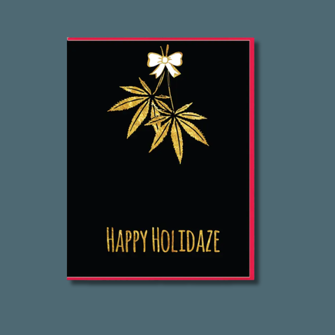 Greeting card with gold leaves and bow on black background, text 'Happy Holidaze'